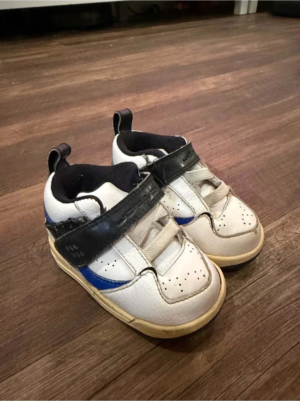 Jordan Kids White Sneakers with Black Strap and Red Jumpman